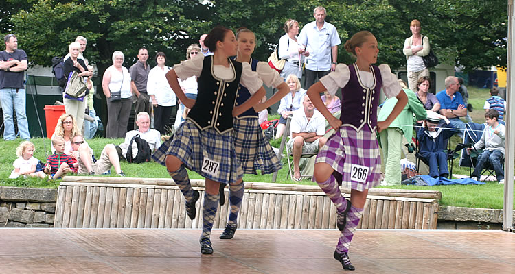Three girls competing in the Highland dancing competitions