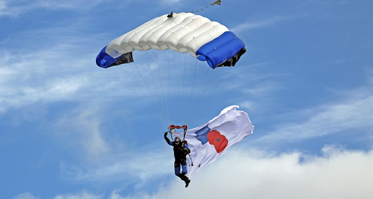 A Jump4Heroes Parachute Display Team lands in the Grand Ring